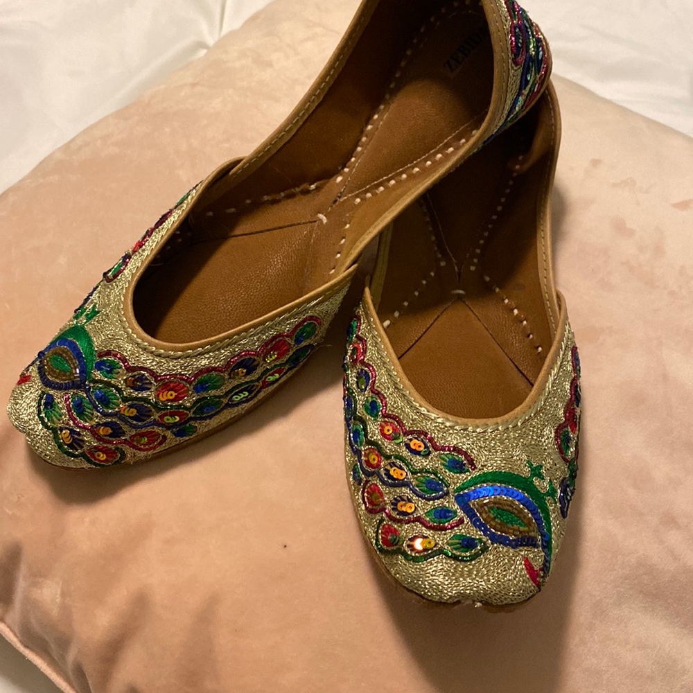 Zebidah peacock gold shoes.